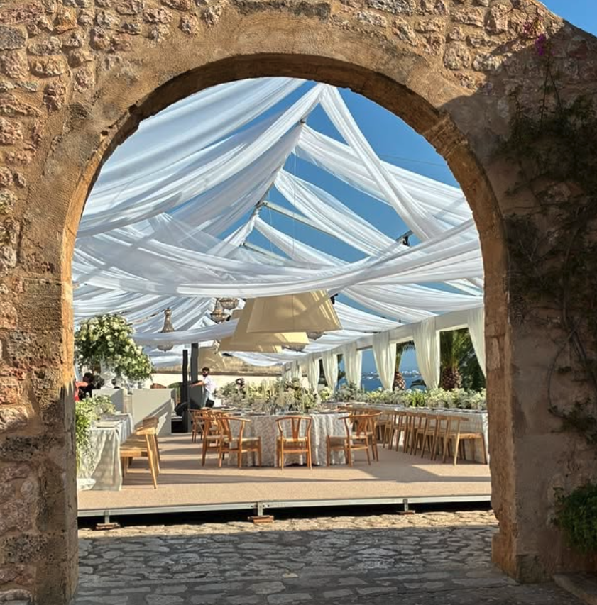 Through the old arch, into the marquee